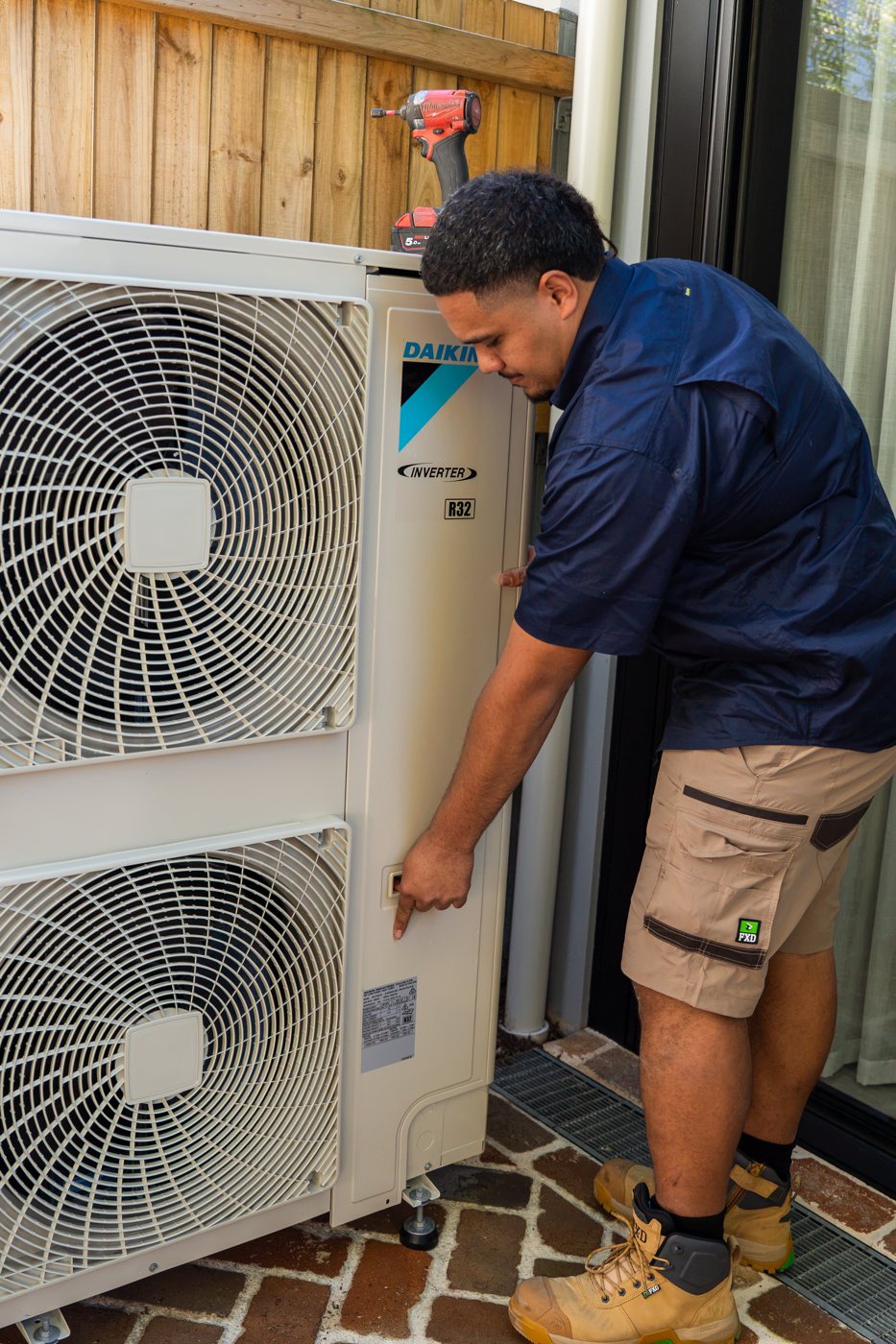 Technician installing a split system